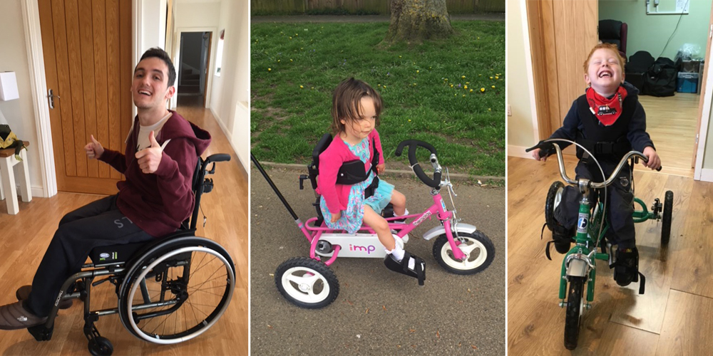 big mobility appeal banner Samuel in his wheelchair, Annabelle on her trike, Fynn on his trike