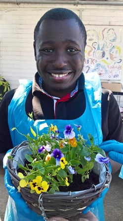 Malik with his hanging basket