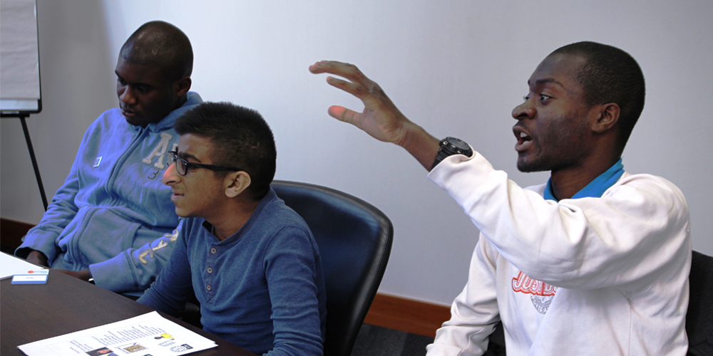 Youth Council members Pernell, Nirav and Patrick in a meeting