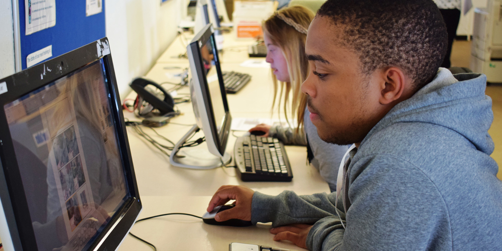 Male student at a desktop computer