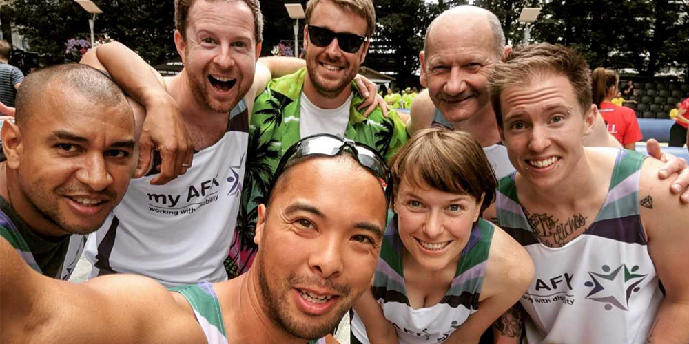 group photo of a team in my AFK running vests