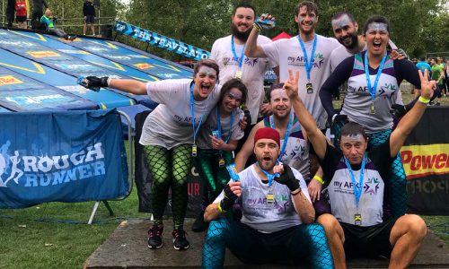 A muddy my AFK team pose for photo after the Rough Runner event