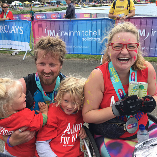 Matt Coynes with his 2 children and Dr Hannah Barham-Brown after completing the Superhero Tri