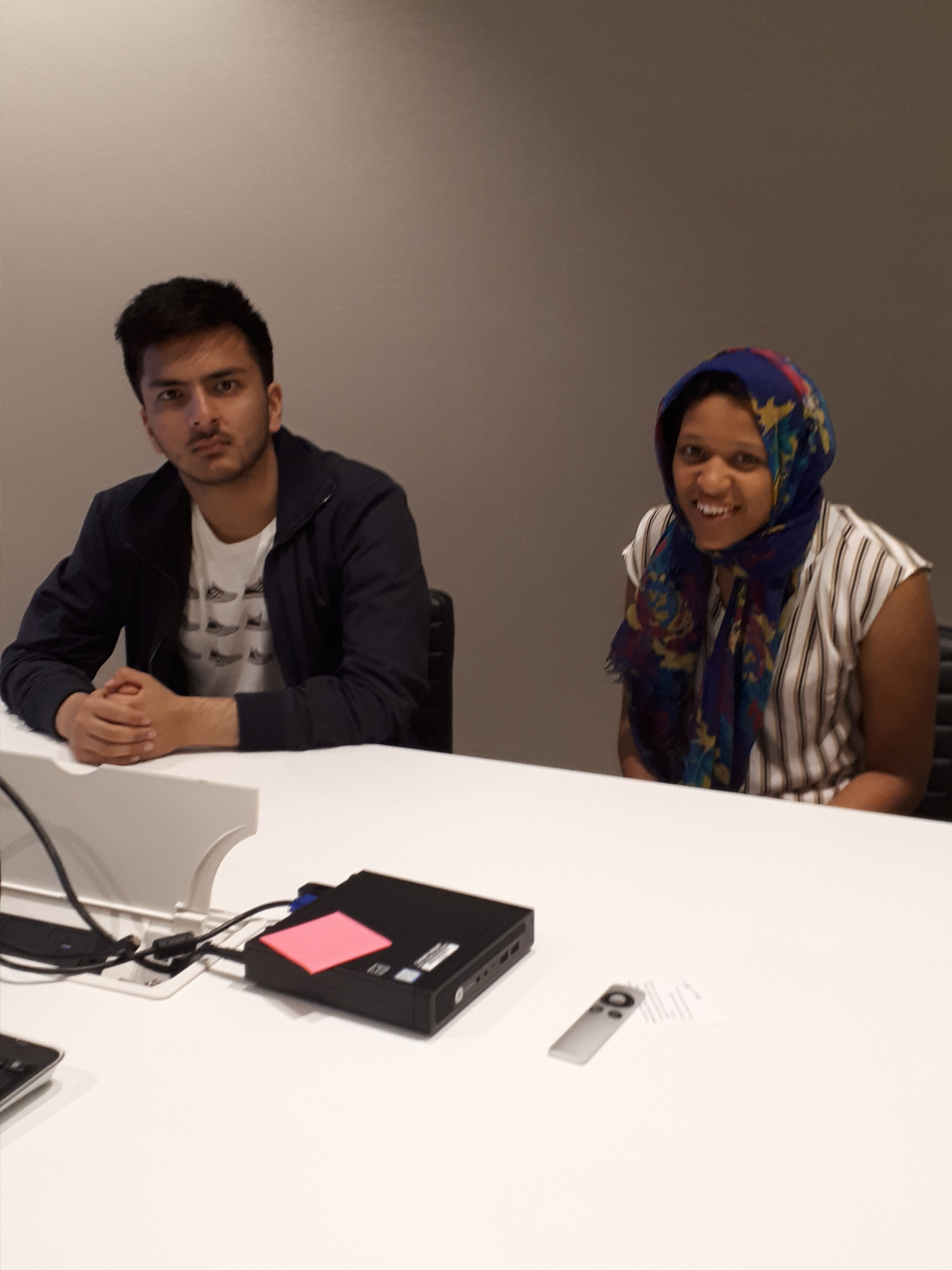 Young man and woman at at desk