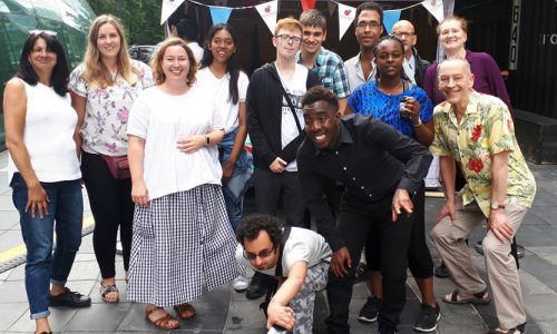 Staff and trainees pose as a group