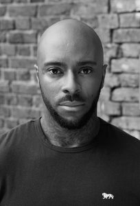 Black and white headshot of AFK Ambassador Ash Archer