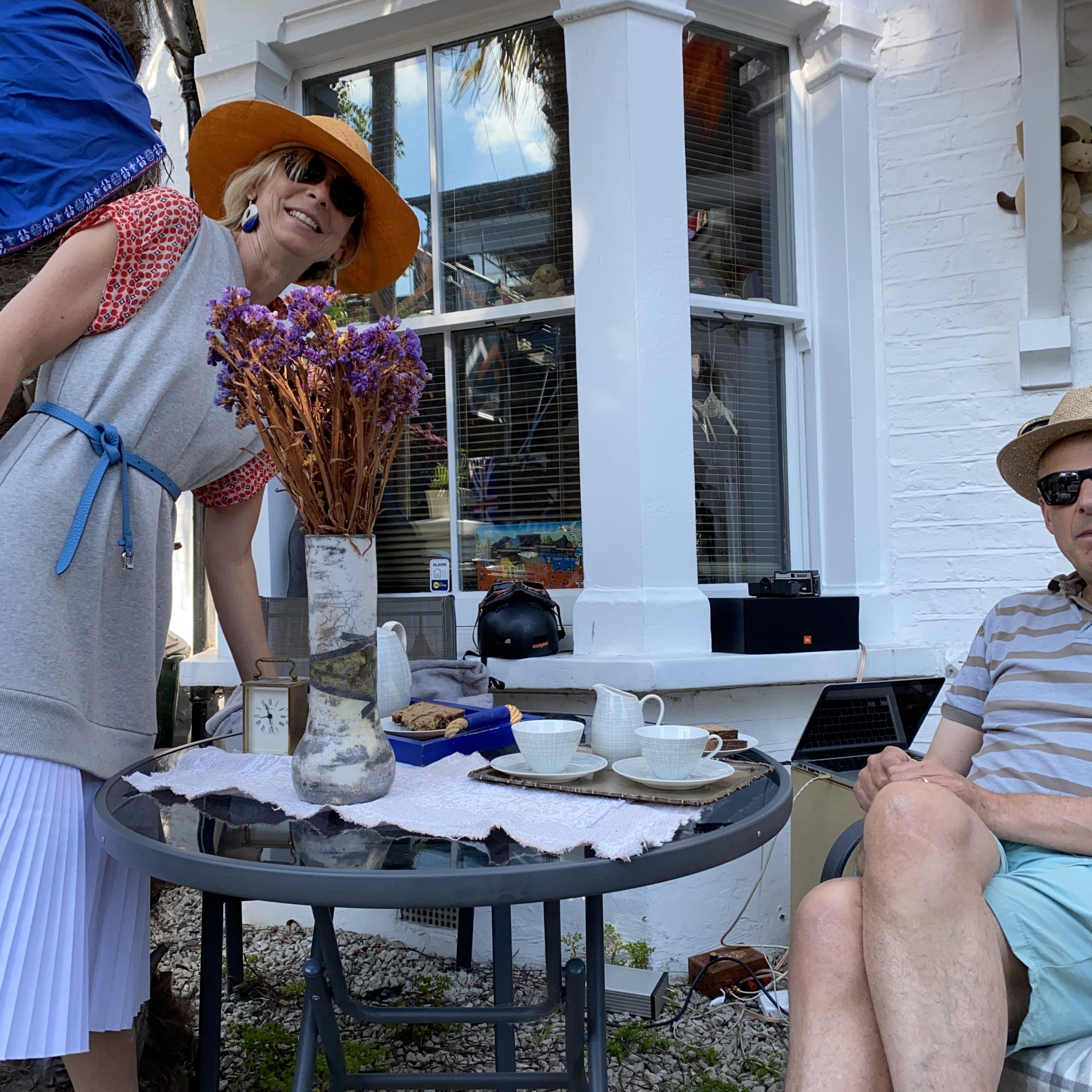 AFK CEO David and his wife celebrating VE Day sitting at a patio table with tea and cake