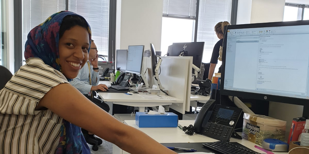 Young woman at a computer desk