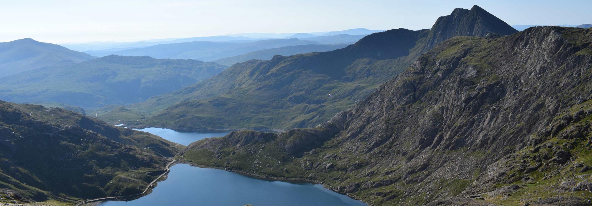 three peaks with lake and sunny day