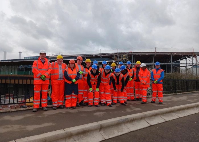 group of people in hard hats on a construction site