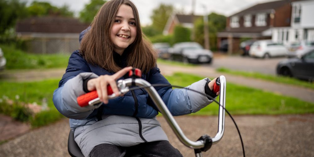 girl smiling on specialised bike