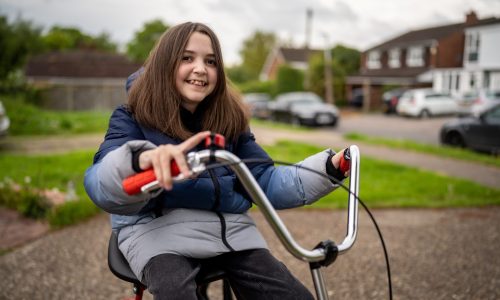 girl smiling on specialised bike