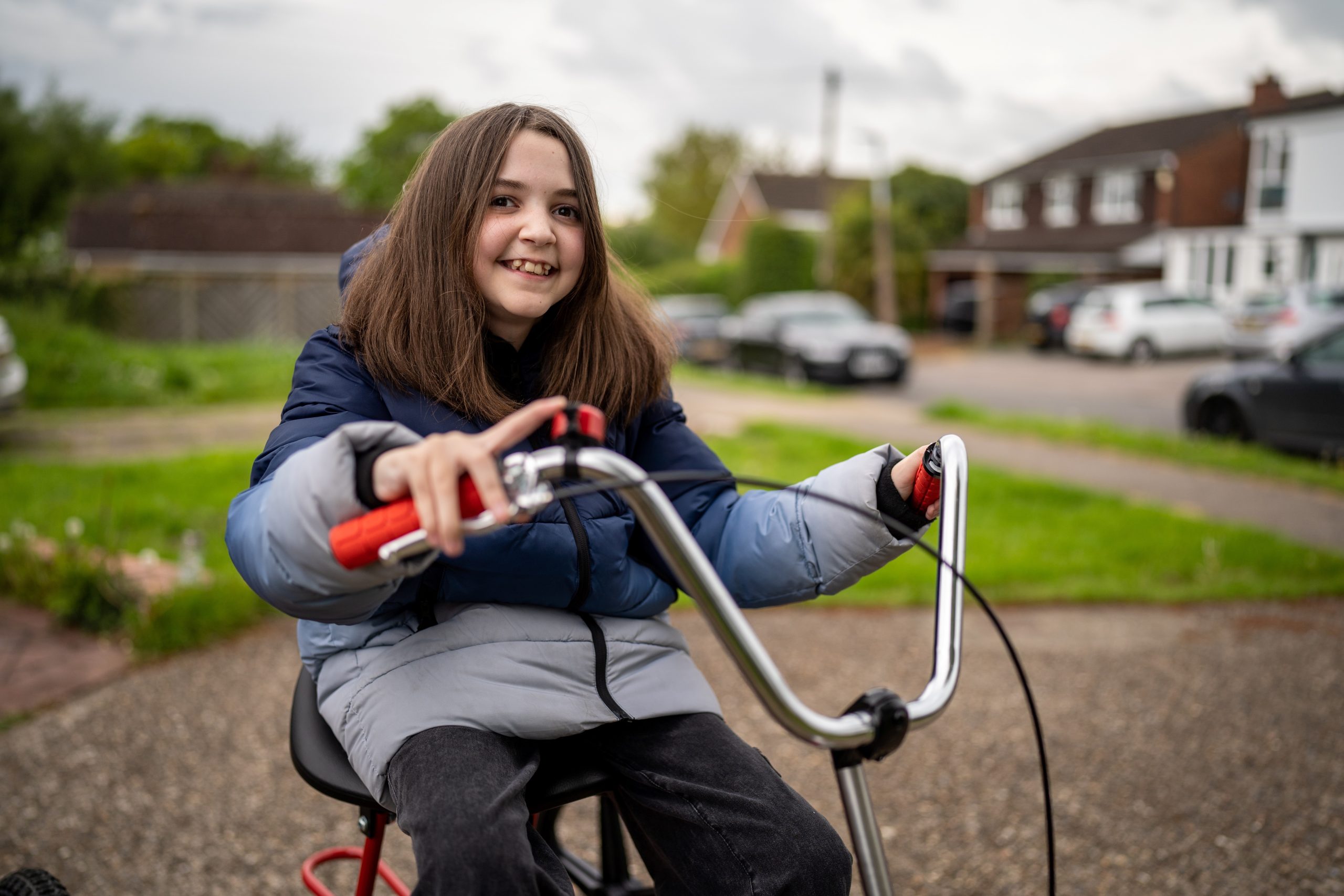 lacey girl smiling on specialised bike