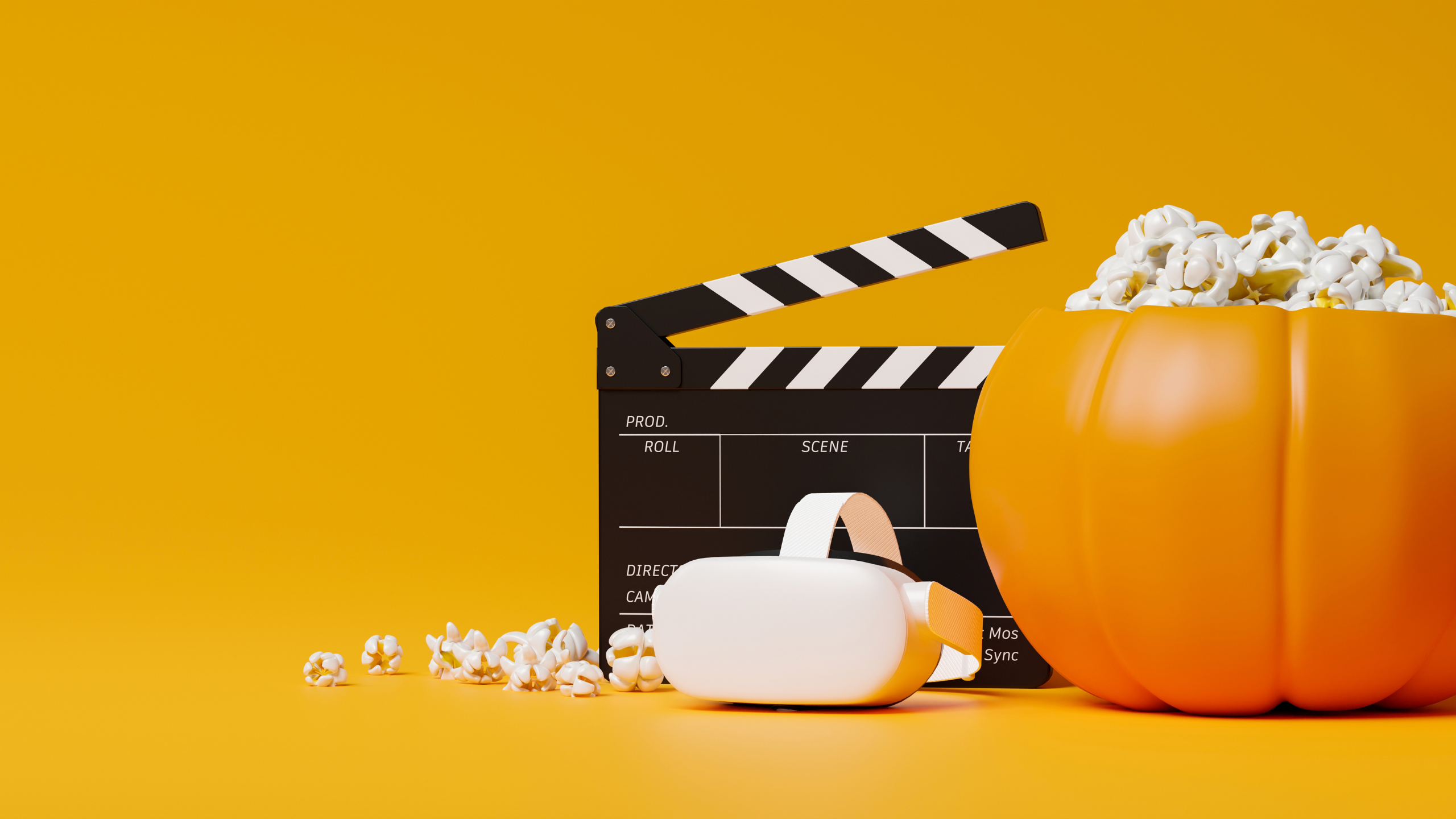 pumpkin filled with popcorn and a directors board